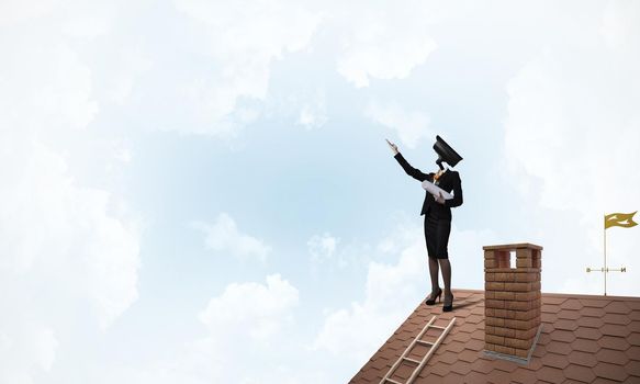 Faceless businesswoman with camera zoom instead of head standing on house roof