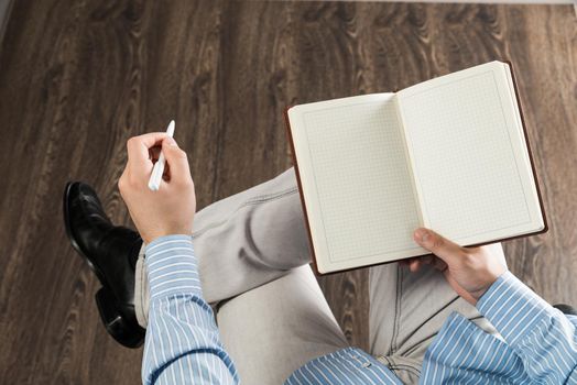 close-up of male hands with notepad, copy space