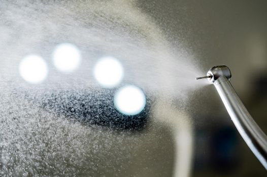 Close the dental turbine with a water spray. Dentist equipment