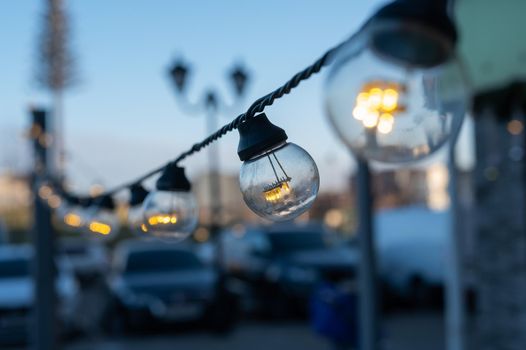 Garland of light bulbs in the park