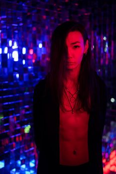 Portrait of a male transgender model in neon light