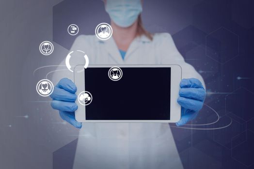 Nurse holding tablet symbolizing successful teamwork accomplishments.