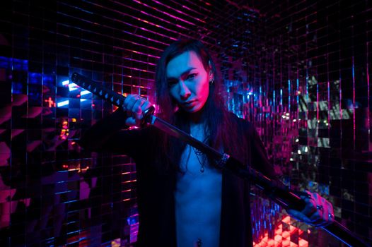 Male transgender neon light studio. Asian with samurai sword