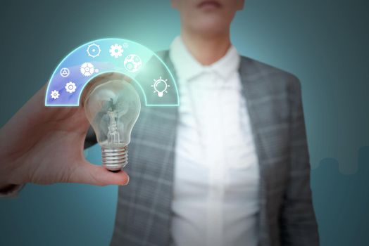 Lady in suit holding light bulb representing innovative thinking.