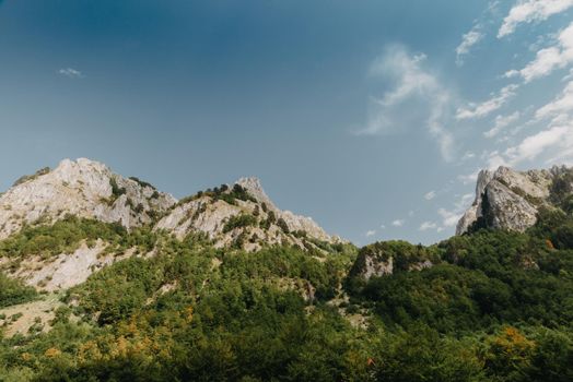 A view of the accursed mountains in the Grebaje Valley. Prokletije, also known as the Albanian Alps and the Accursed Mountains, is a mountain range on the Balkan peninsula, extending from northern Albania to Kosovo and eastern Montenegro.