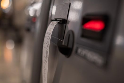 Close-up ATM prints out a check