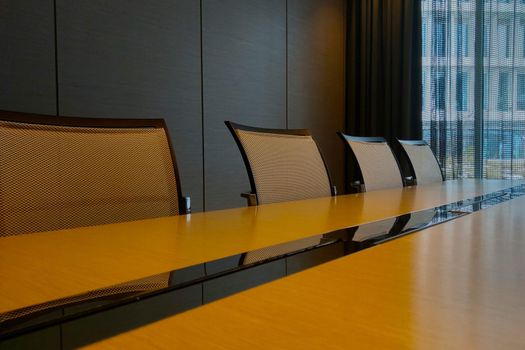 Modern meeting room in the office. Large table and chairs