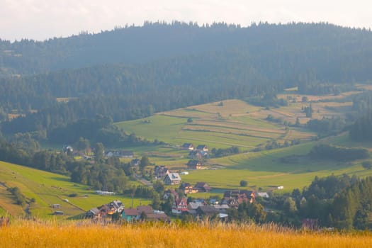 View of a small mountain village on an autumn sunny day