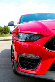 Front view of a red modern car. modern optics