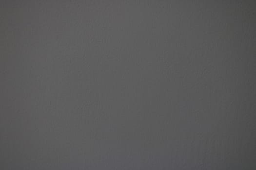 Textured dark gray paper, background. Concrete wall