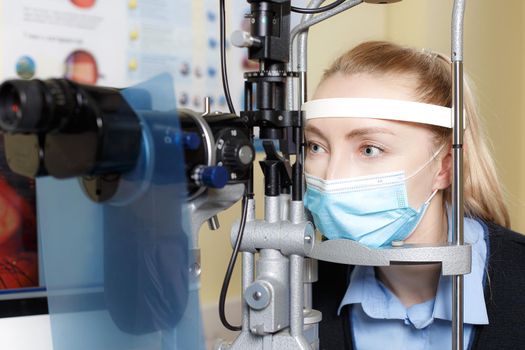 Portrait of a Caucasian female checking eyesight in an ophthalmologist clinic