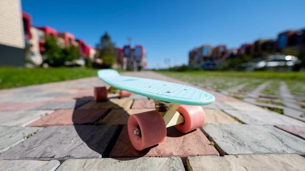 Close-up of a penny board outdoors on a warm summer day