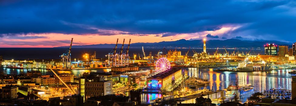 Evening view of Genoa (Genova) port, Italy with port cranes and industrial zone. Genoa, Italy
