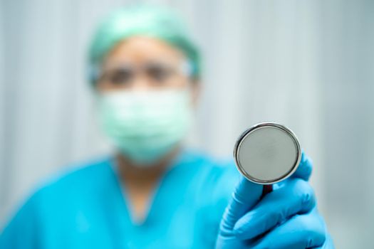 Asian doctor wearing face shield and PPE suit new normal to check patient protect safety infection Covid-19 Coronavirus outbreak at quarantine nursing hospital ward.