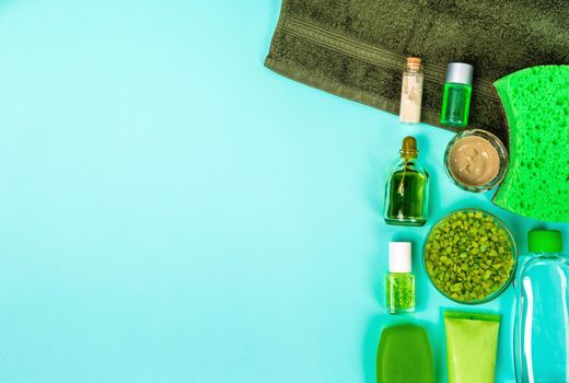 Spa set: soap, mask, oil, sea salt and towel. Top view. Still life Copy space