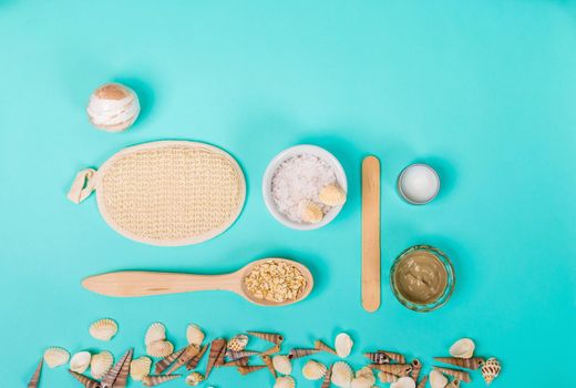 Spa sea salt, shells on blue background. top view. still life. Copy space