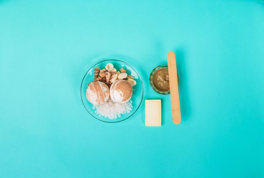 Spa sea salt, shells on blue background. top view. still life. Copy space