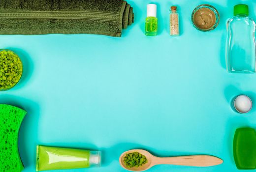 Spa set: soap, mask, oil, sea salt and towel. Top view. Still life Copy space