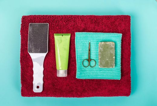 Top view of manicure and pedicure equipment on blue background. Still life.