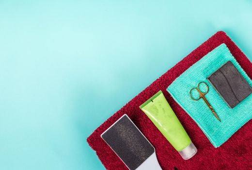 Top view of manicure and pedicure equipment on blue background. Still life. Copy space