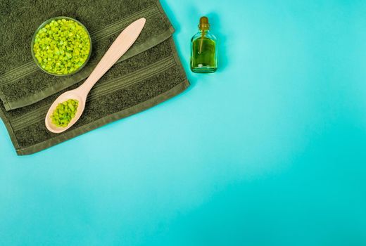 Spa set: oil, sea salt and towel. Top view. Still life. Copy space