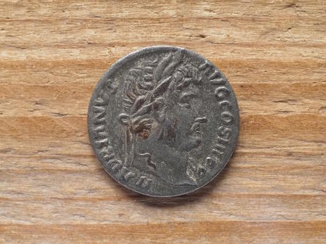 Ancient Roman denarius coin obverse side showing Hadrian emperor Augustus consul for third time father of nation circa 130 bC