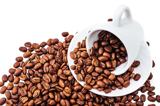 white cup with coffee beans isolated