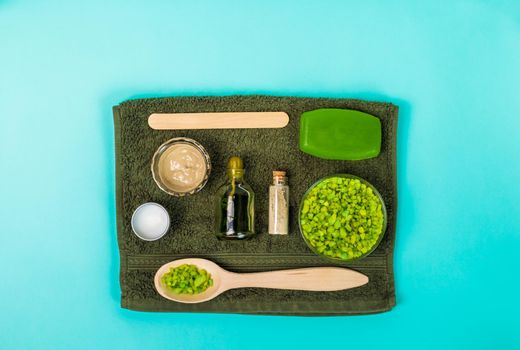 Spa set: soap, mask, oil sea salt and towel. Top view. Still life