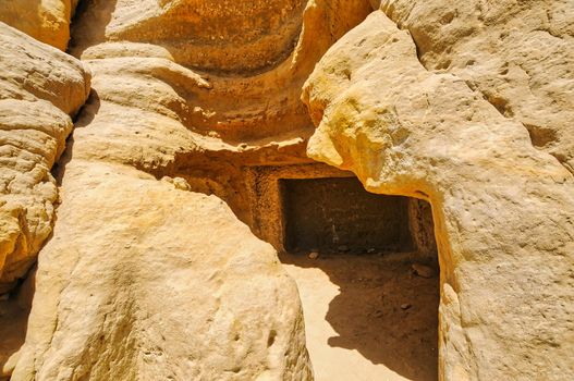 Matala beach with caves on the rocks that were used as a roman cemetery and at the decade of 70's