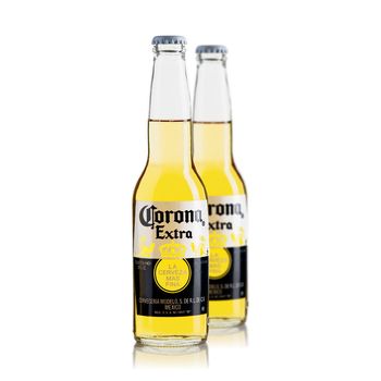 Tallinn, Estonia - March, 2022: Corona Extra beer isolated on white, produced by Cerveceria Modelo in Mexico.