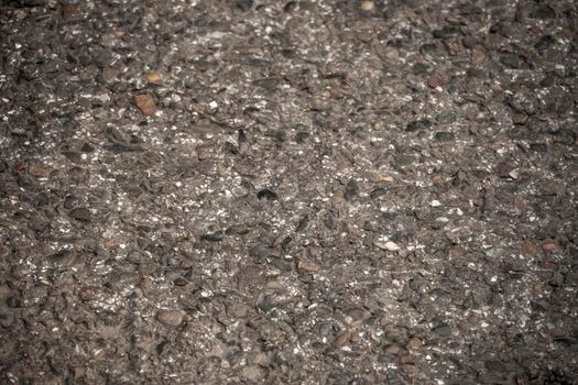 The texture of fresh asphalt lined up close. Pavement
