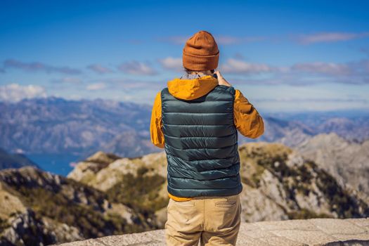 Man traveller in mountain landscape at national park Lovcen, Montenegro. Travel to Montenegro concept.