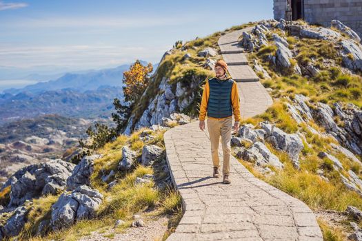 Man traveller in mountain landscape at national park Lovcen, Montenegro. Travel to Montenegro concept.