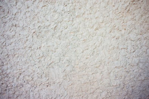 Abstract background of chaotically plastered cement on the wall. Cement pattern. Cement stucco molding on the walls of the building