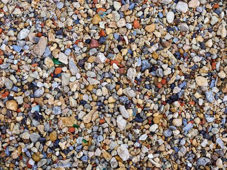 Beach of color rocks pebbles close up texture background