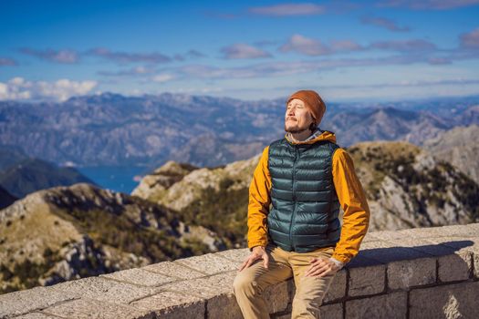 Man traveller in mountain landscape at national park Lovcen, Montenegro. Travel to Montenegro concept.