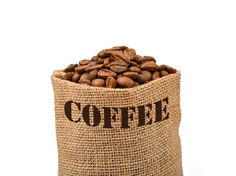 Close up one jute canvas bag of roasted Arabica coffee beans isolated on white background, low angle side view