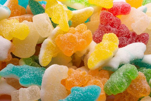 closeup of colored animal jelly beans with sugar occupying the entire horizontal image