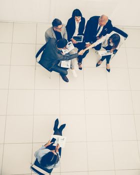 top view. a group of business people discussing business documents . photo with a copy of the space