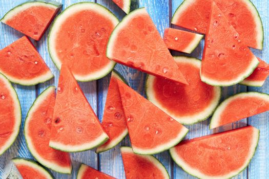 Watermelon cut into pieces to be served in a dining room