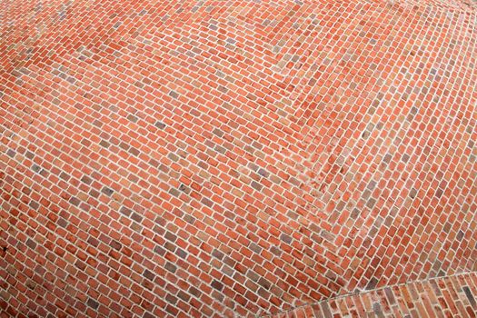 Fragment of the surface of a spherical red brick roof