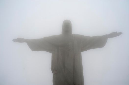Rio de Janeiro, Brazil - September 14, 2019.  Redeemer Christ statue on Corcovado hill covered with fog.