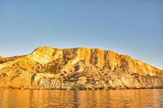 Coast of Crete island in Greece. Red Beach of famous Matala. Filtered retro toned style...