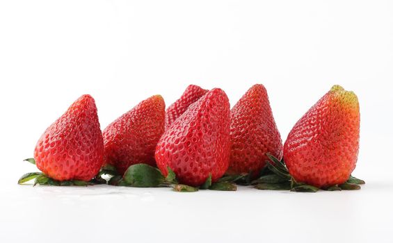 Pile of fresh strawberries on white background.