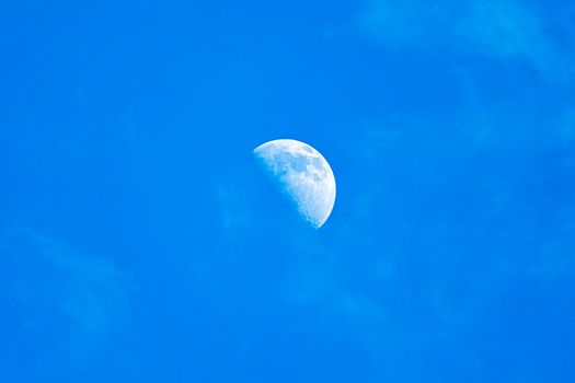 moon day field. moon in a blue cloudless sky