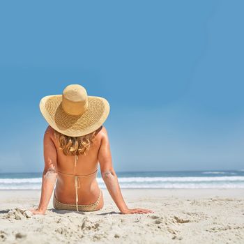 Girl on the beach in summer sunshine.