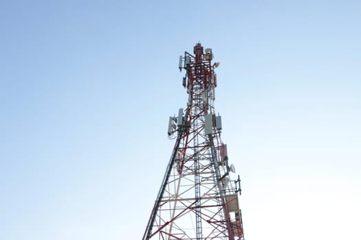 Modern mobile tower against the blue sky. Modern technologies. 5G