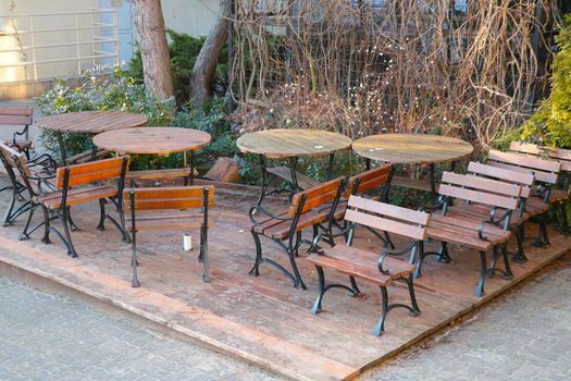 Empty tables and chairs outside the cafe. No visitors. The aftermath of the coronavirus. Bankruptcy