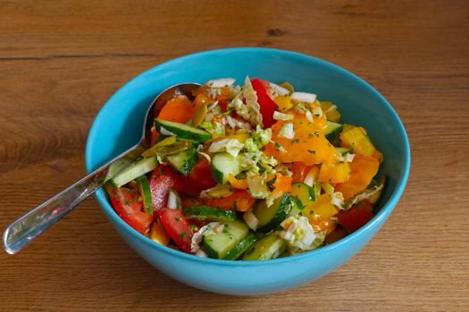 A plate with bright and delicious vegetables, a light salad