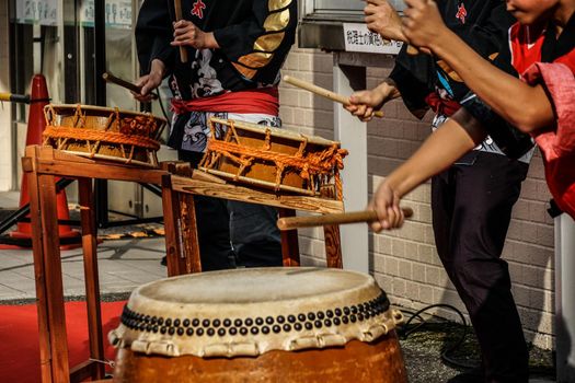 Kids image of hitting Japanese drums. Shooting Location: Tokyo metropolitan area